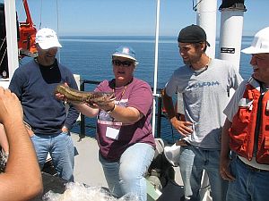 Dr. Auer shown holding a Lake Superior Burbot